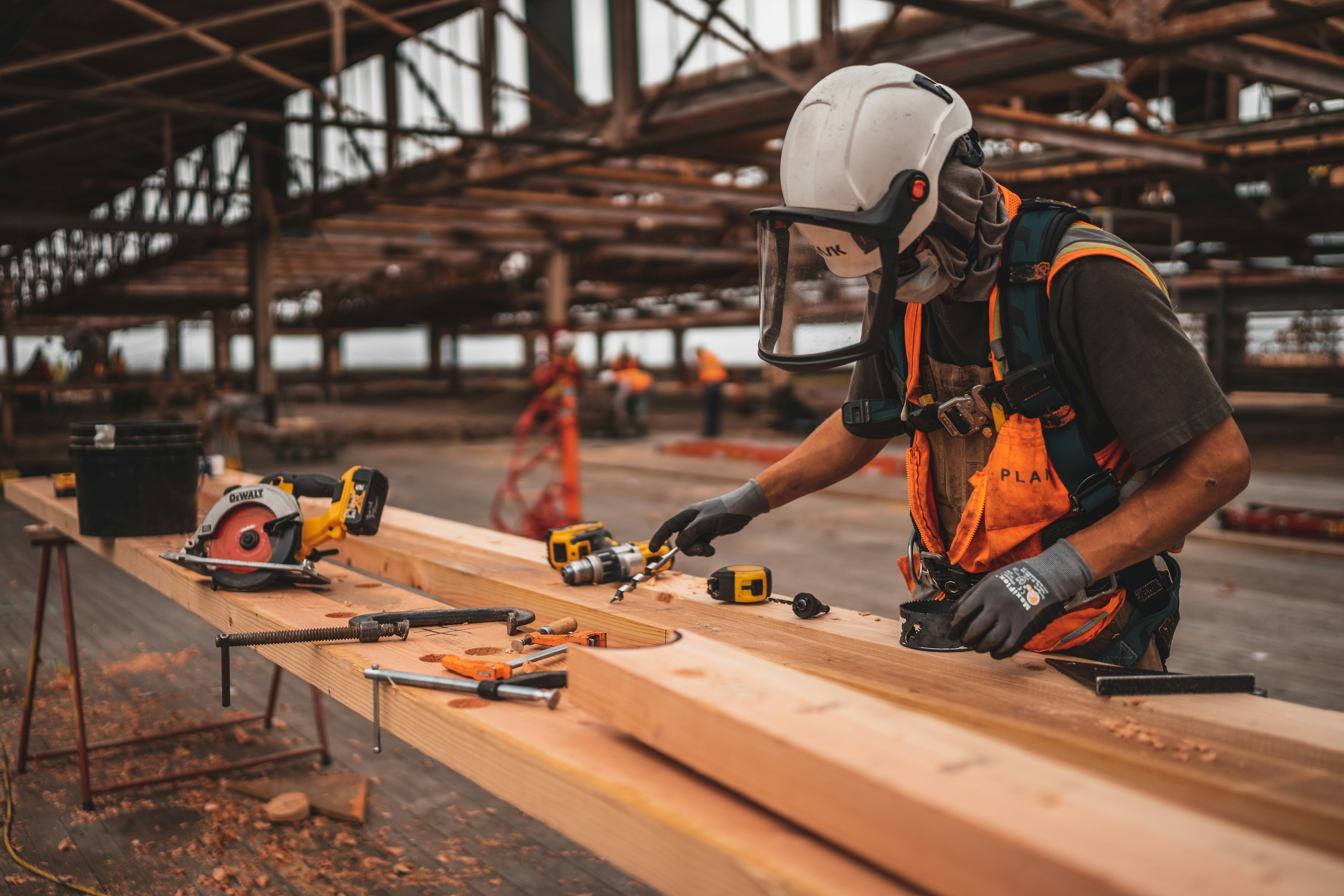 Worker cutting wood on-site